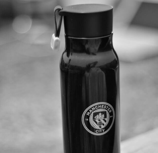 Manchester City logo on a bottle